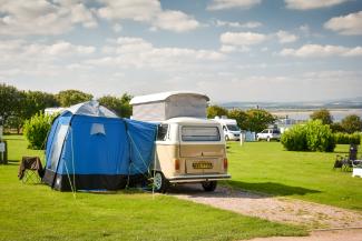 Retro VW camper can with awning on Clifftops Touring Field at St Andrews Holiday Park