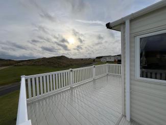 The Oakley - extensive decking with great view, nestled behind the sand dunes