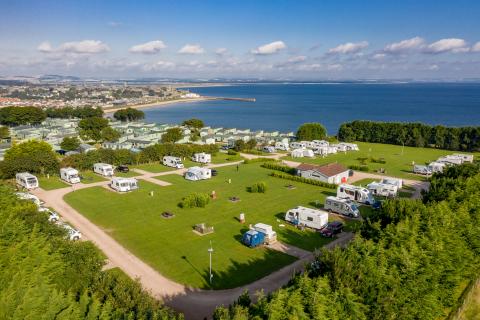 Aerial view of Clifftops Touring Field at St Andrews Holiday Park on a sunny day