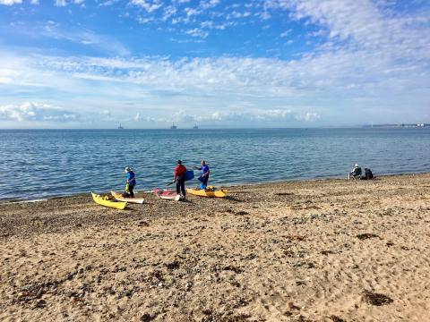 kayakers on the shoreline at Largo Bay