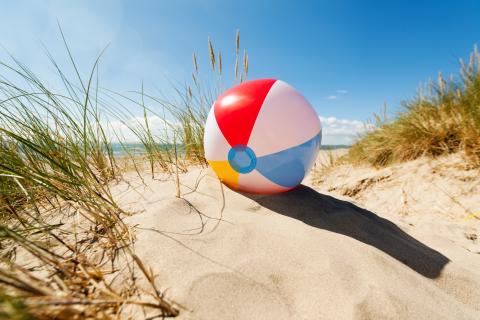 beach ball on sandy dunes on a summer's day