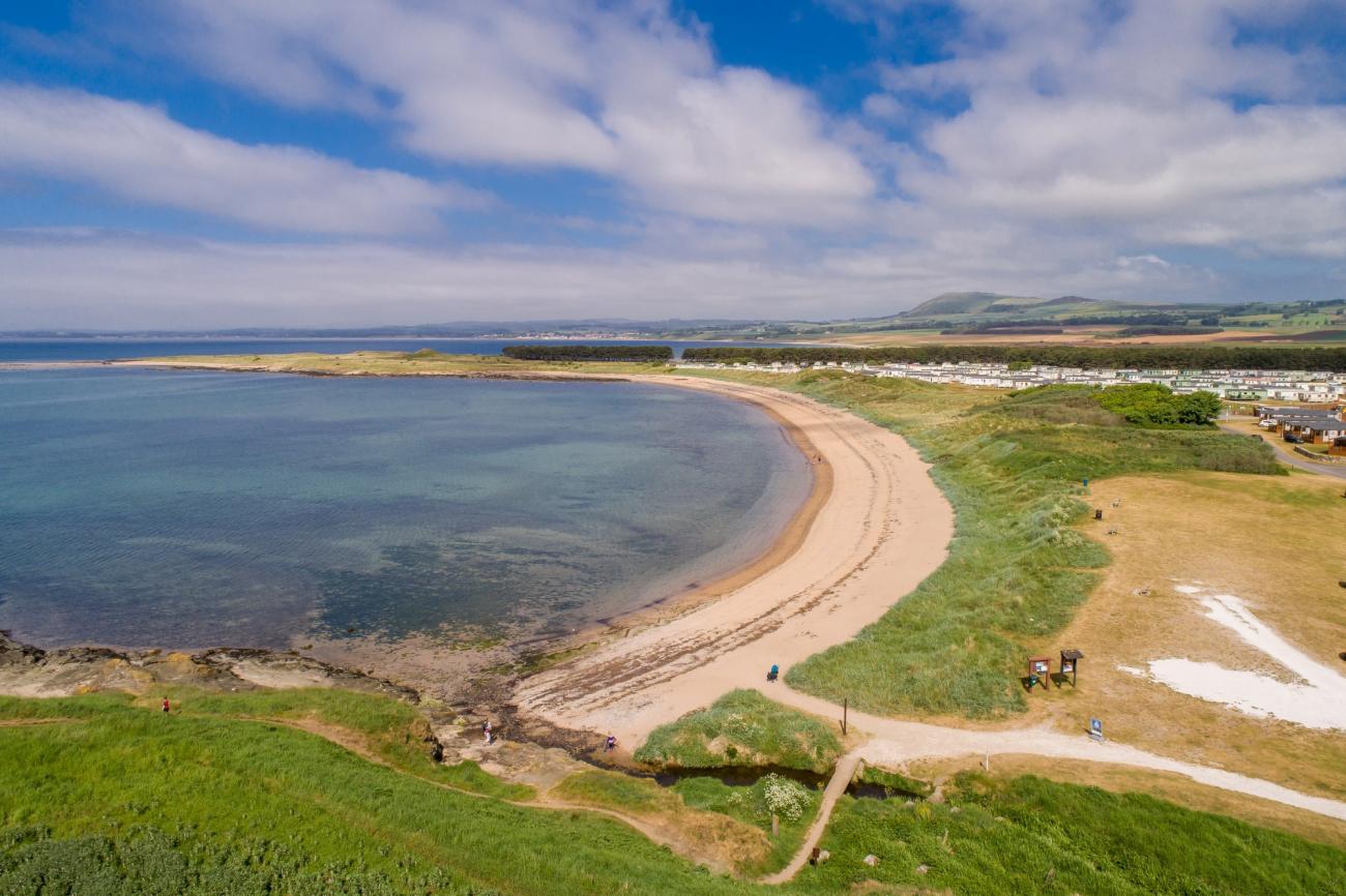 Castaway holiday homes close to sweeping sandy beach