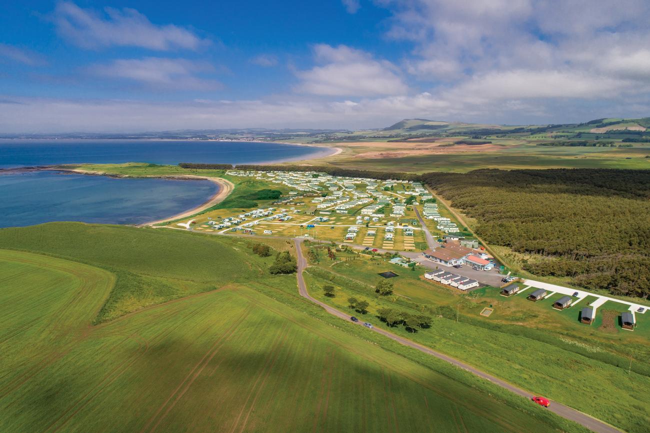 Aerial view of Elie Holiday Park at Shell Bay on a sunny, summer's day