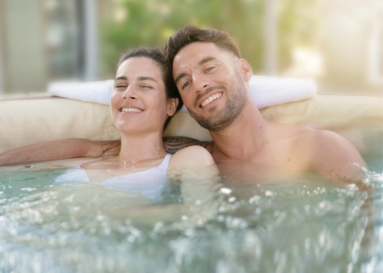 Young couple enjoying a hot tub