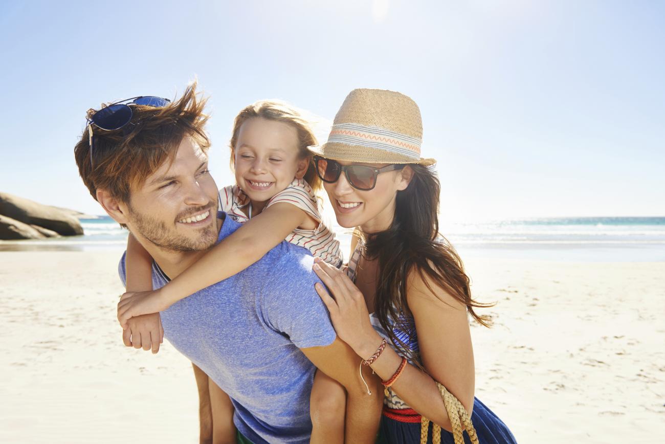 Happy family on beach on a sunny day