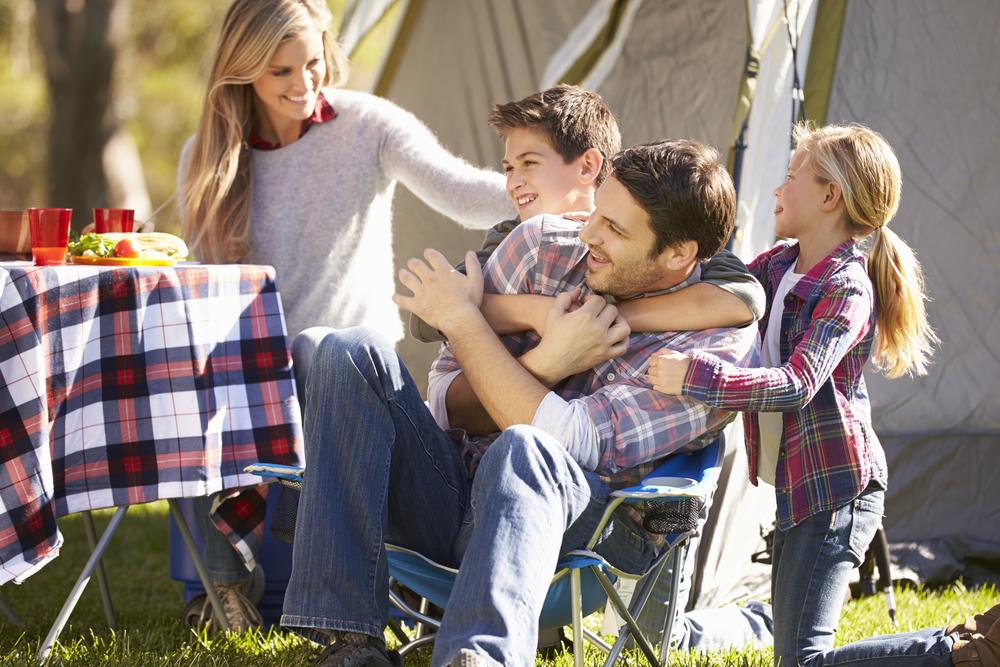 Family eating outside tent