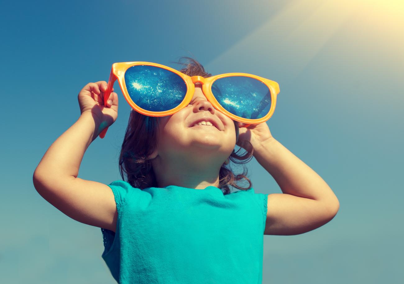 Happy girl wearing oversized sunglasses