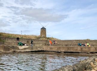 Families wild water swimming in St Monans tidal pool