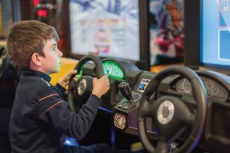 Boy playing driving game