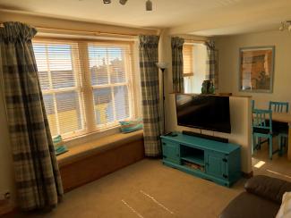 Living area at 103 Robinson Crusoe's Retreat Cottage
