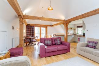 Baillie Scott - open plan living with Juliet balcony