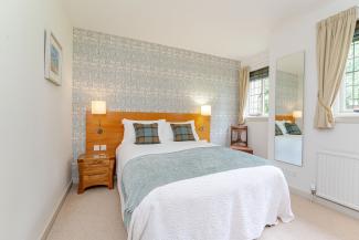 Baillie Scott - double bedroom with garden views