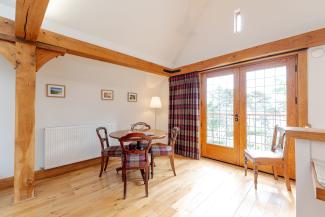 Baillie Scott - dining area with Juliet balcony