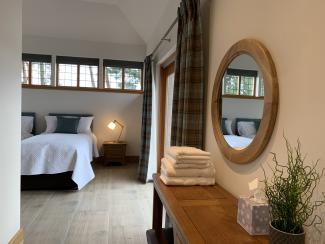 The Coach House - master bedroom with en suite wet room