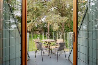 The Giddy Limit - spacious balcony with garden views
