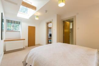 The Giddy Limit - double bedroom with feature skylight
