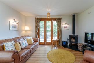 The Lady Bluebell - luxury lounge with bi-fold door opening onto sun terrace